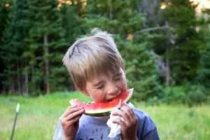 Maverick Dean Farner eating watermelon