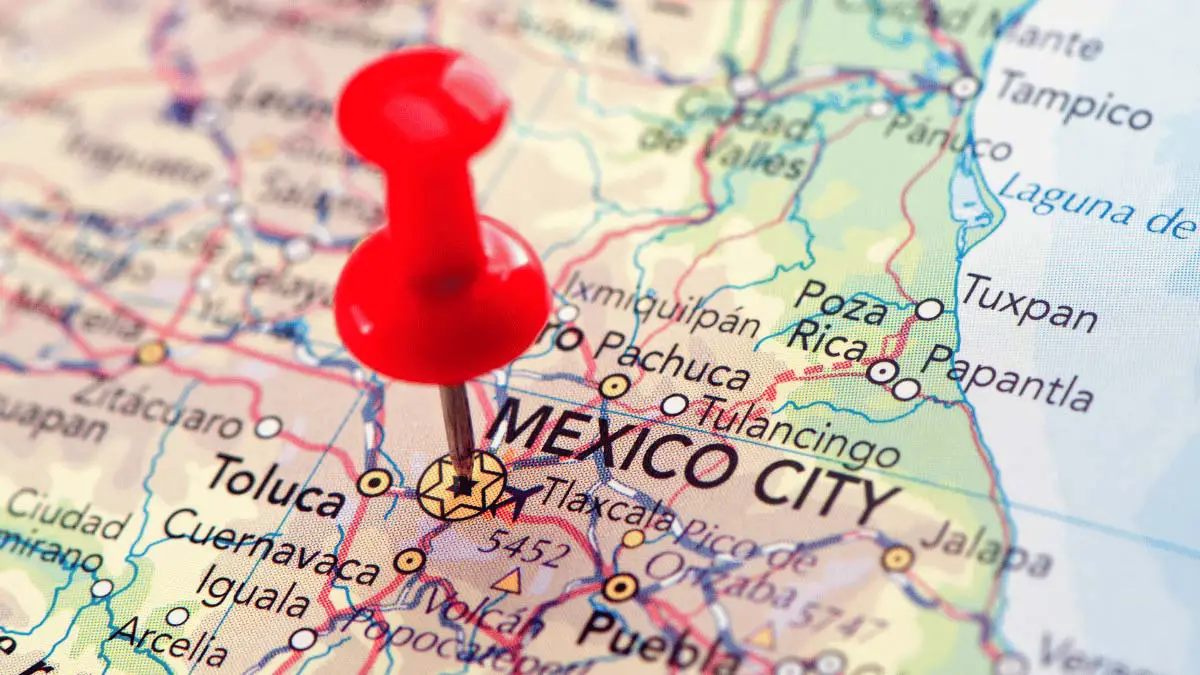 Photo of Red Thumb Tack Matching Mexico City on a Map for a Student Essay Titled "why is Sociology Important? the Case of Mexico City"